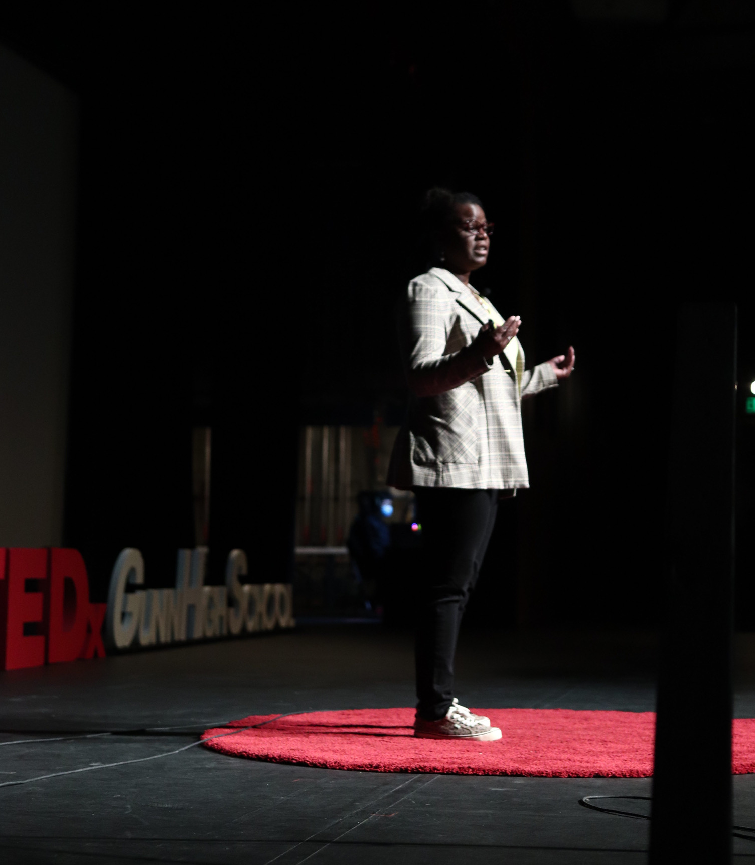 Dr. Abigail Joseph on red carpet dot of TEDxGunnHighSchool
